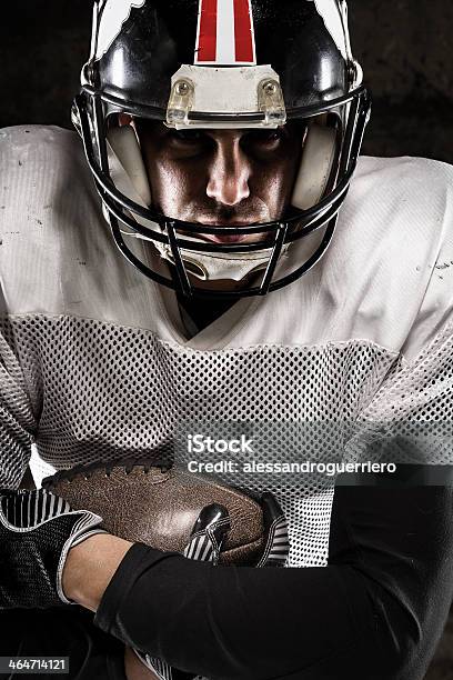 Portrait Of American Football Player Holding A Ball Stock Photo - Download Image Now