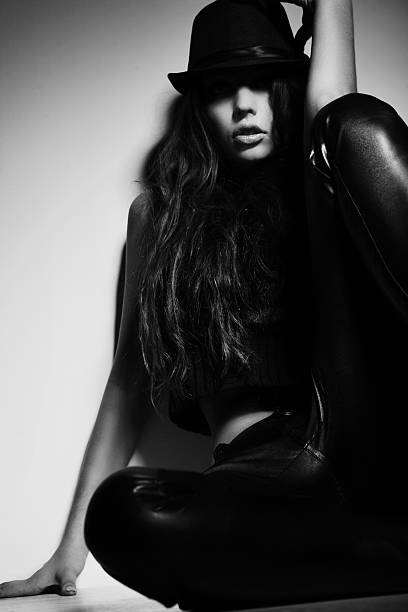 istock Young woman sitting on the floor 464714639