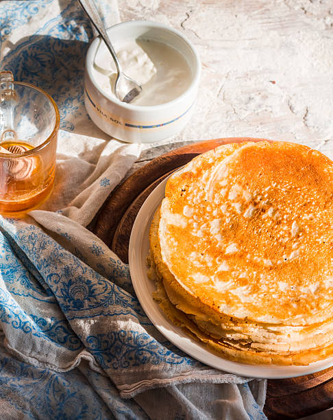 istock many subtle sweet pancakes with honey and sour cream 464716890