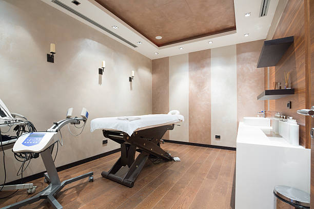 istock Massage room at modern spa center 464717228