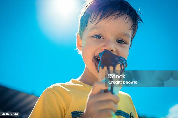 Three Year Old Boy Eats Chocolate Icecream Stock Photo - Download Image Now - Ice Cream, Melting, Ice