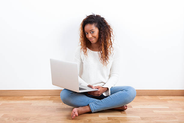 istock African American student girl using a laptop computer 464720420