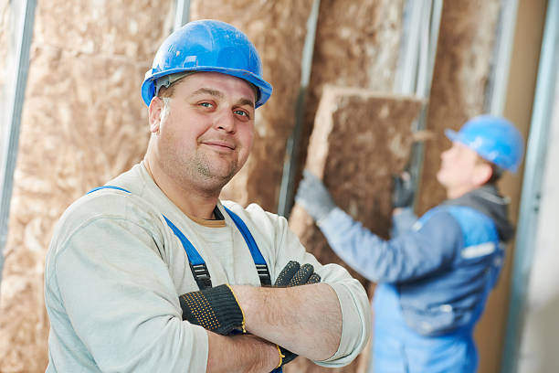 Construction worker at insulation work stock photo