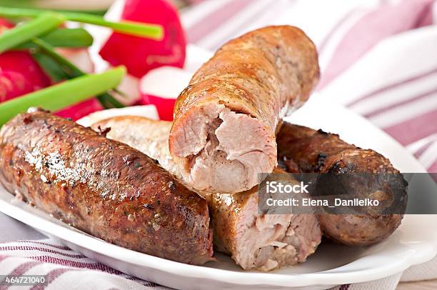 Homemade Sausages Baked In The Oven And Salad Stock Photo - Download Image Now - 2015, Bacon, Baked