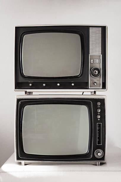 istock Two vintage televisions on white background 464721625