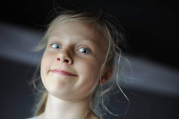 istock Blond girl making silly face 464724870