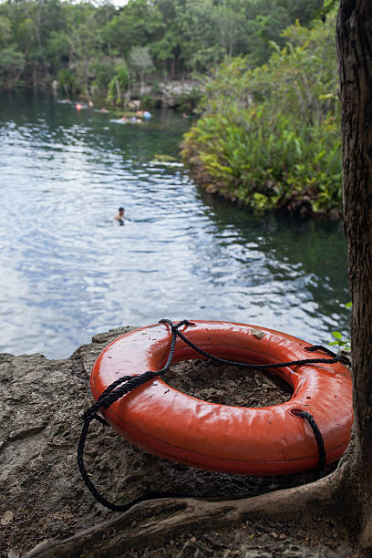 istock Life buoy on lake background 464726532