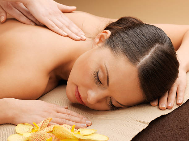 istock beautiful woman in massage salon 464728089