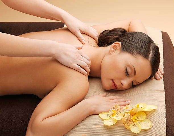 istock beautiful woman having massage at spa salon 464728355