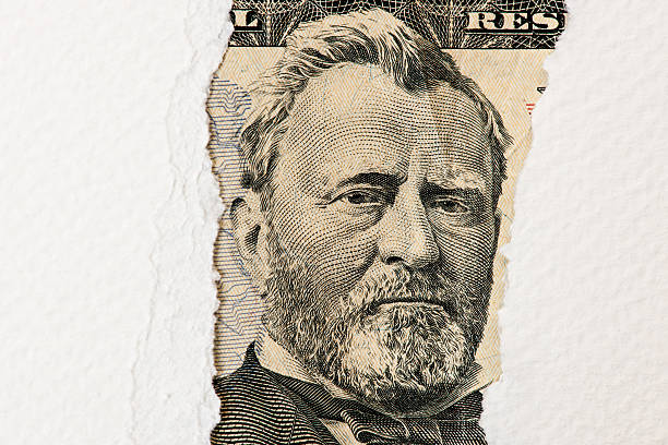 istock Torn sheet of paper on dollar 464729444