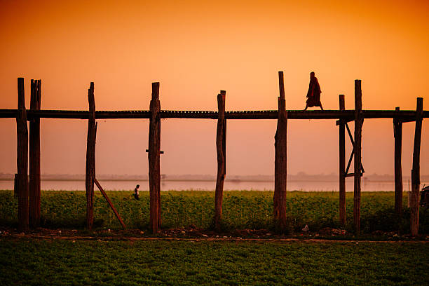 istock Monk Walking the U Bein Bridge Myanmar 464731142