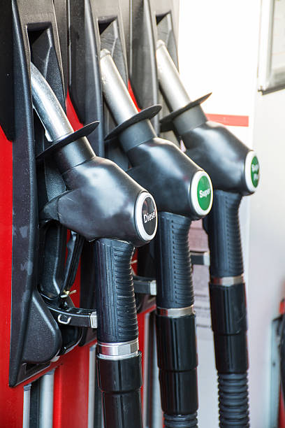 istock gas pump nozzles in a service station 464731210