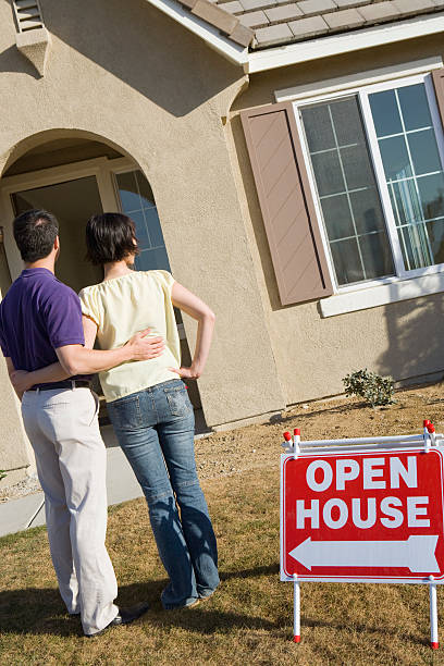 istock Couple with new home 464735602