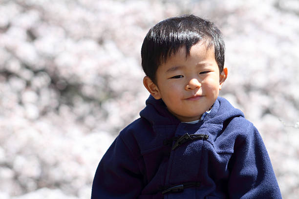 istock Infant and the cherry blossom 464744443