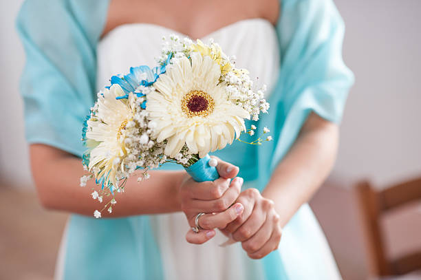 istock bride holding a bouquet blue and white 464745286