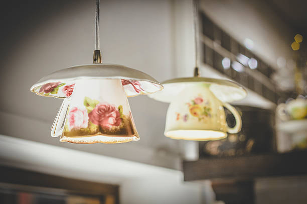 istock Lights made of tea cups hanging from the ceiling 464745466