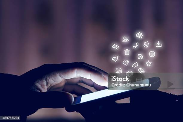 Using Smartphone At Night Stock Photo - Download Image Now - 2015, Business, Communication