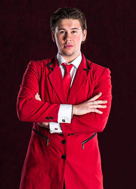 istock Elegant smiling young handsome man in red suit 464749280