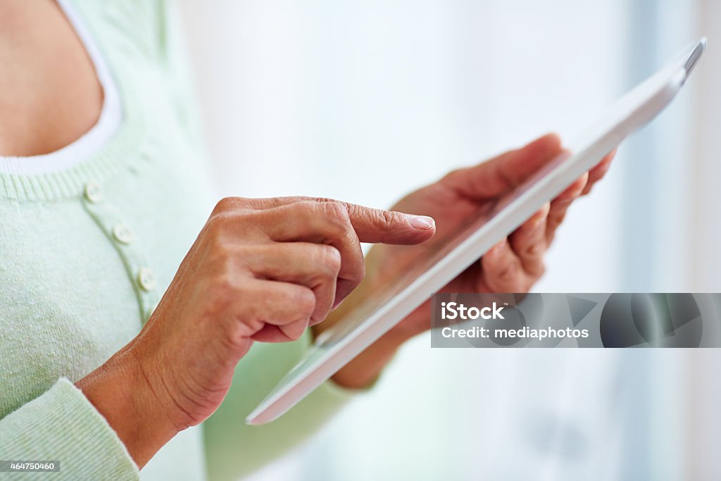 Using tablet computer Senior woman using tablet computer 2015 Stock Photo