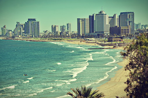 The Tel Aviv, Israel sky line and the Mediterranean beach from Jaffa - old postcard / vintage look