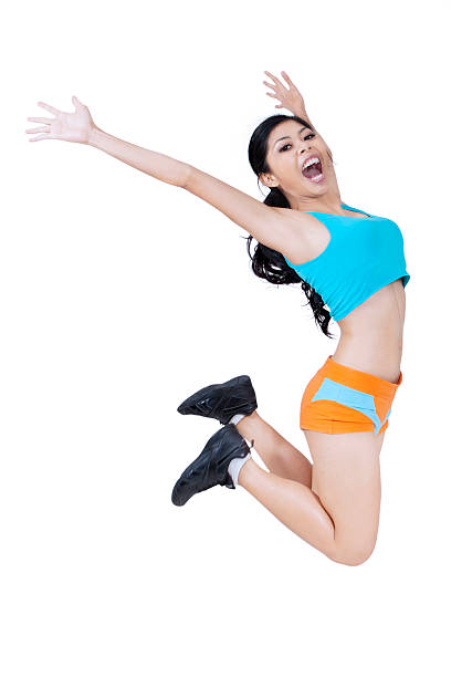 istock Sporty woman jumping over white 464754584