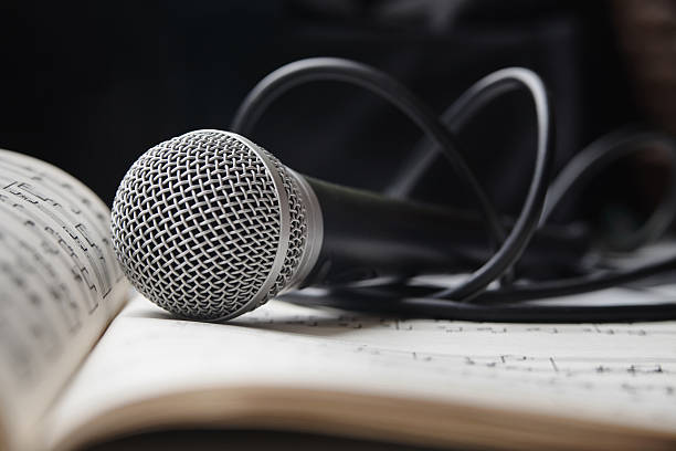 istock Microphone on sheet of music 464754830