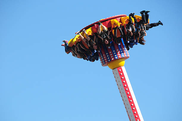 Frightening Ride at Coney Island Amusment Park, New York New York, USA - September 27, 2014: People betweeen air and earth on a frightening Ride at Coney Island Amusment Park, New York neta degany stock pictures, royalty-free photos & images