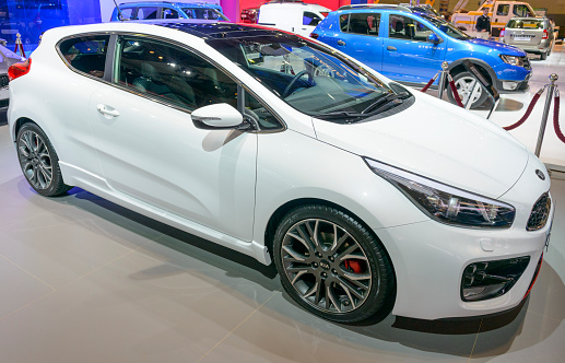 Brussels, Belgium - January 15, 2015: Kia pro_cee'd hatchback car on display during the 2015 Brussels motor show. People in the background are looking at the cars.