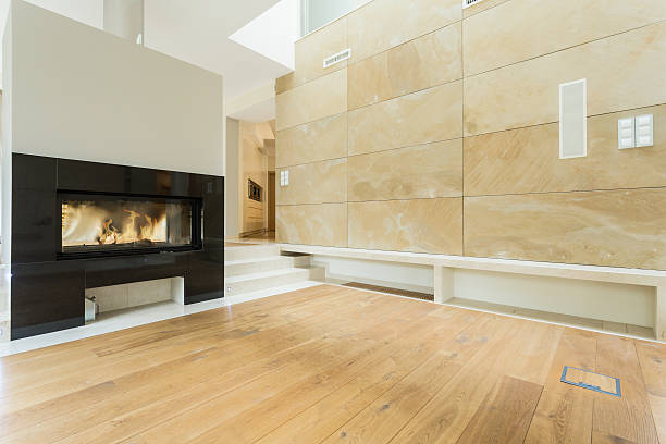 istock Burning fireplace in beige house 464757140