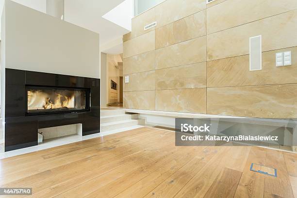 Burning Fireplace In Beige House Stock Photo - Download Image Now - 2015, Apartment, Architecture