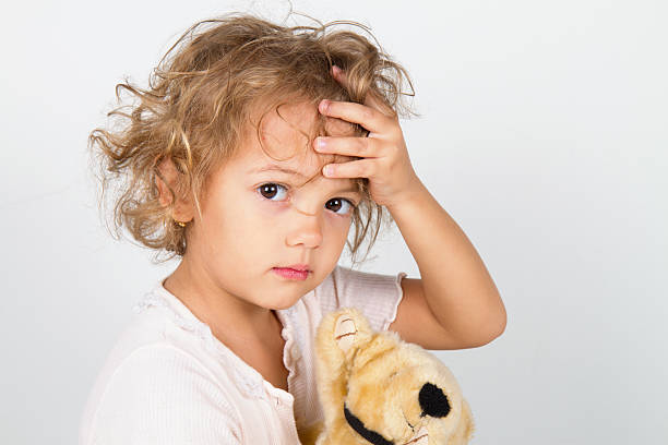 child with headache stock photo