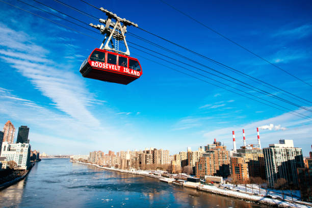 Roosevelt Island Tramway New York New York City, United States - February 23, 2015: Commuters traveling on the Aerial Tramway from Manhattan to Roosevelt Island. roosevelt island stock pictures, royalty-free photos & images