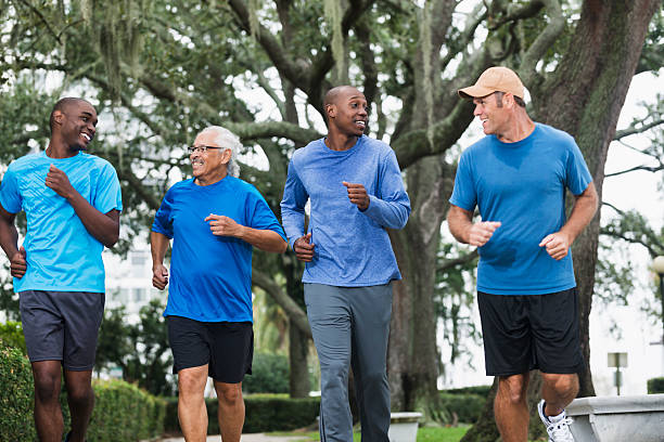 istock Multiracial group of men running in the park 464768756
