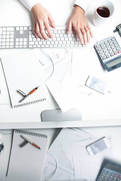 istock Stockbroker working at desk, keyboard 464769136