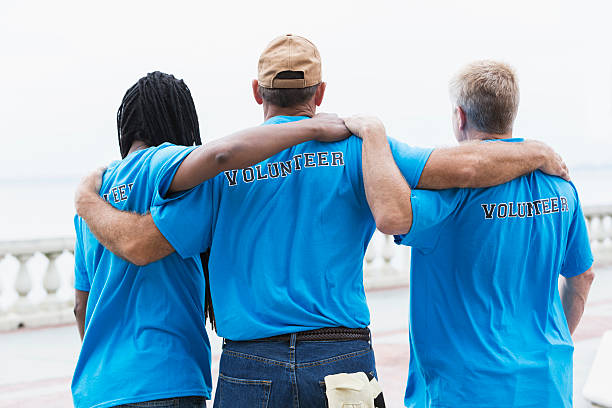 istock Multiracial group of volunteers standing together 464769210