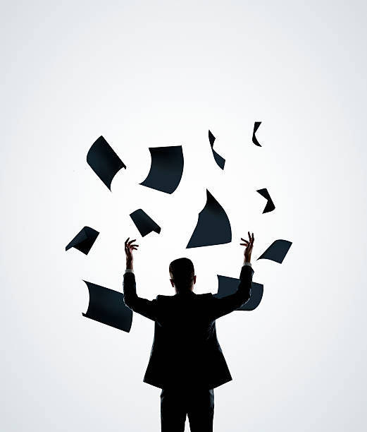 istock businessman throwing paper 464771175