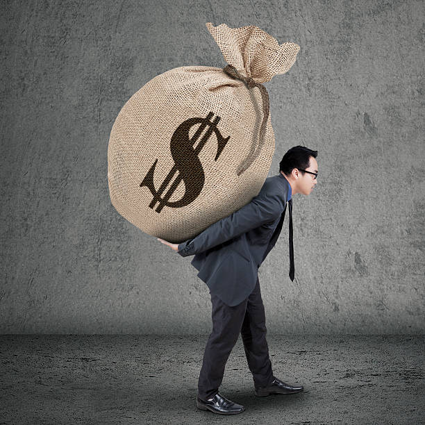 istock Young manager carrying money bag 464772042