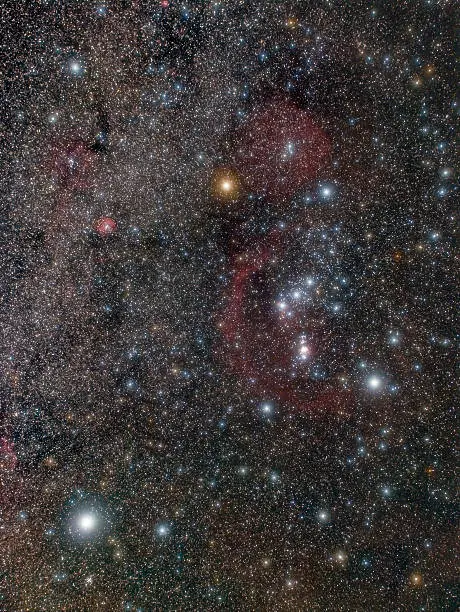 Orion constellation - a wide angle, long exposure photo shows a myriad of colorful stars and large interstellar nebulae in the night sky, too faint for the naked eye. All of them are real, not an artificial digital rendering.