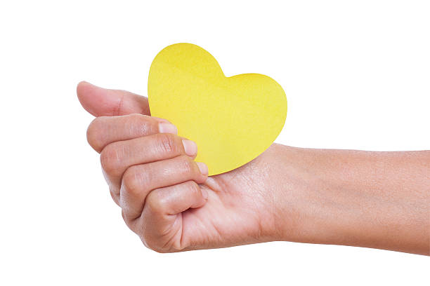 istock hand holding paper heart, 464773489