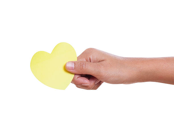 istock hand holding paper heart, 464779201