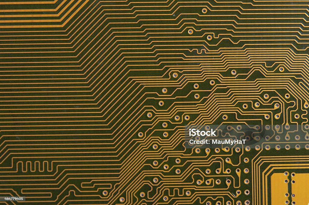 Circuit board digital highways Close-up photo of circuit board in gold and black. Circuit Board Stock Photo