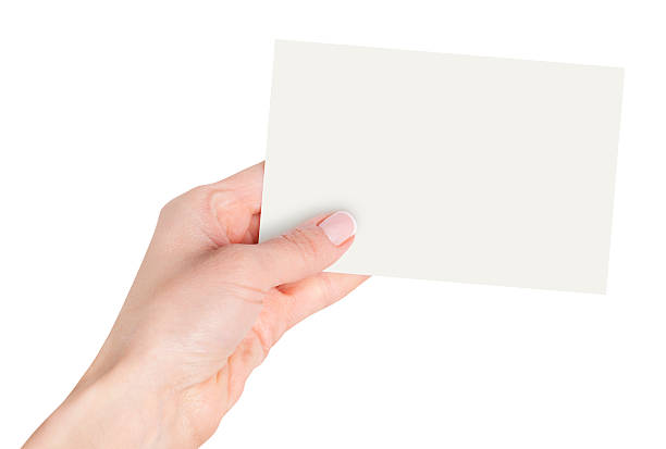 istock Women's fingers holding a blank business card 464780348