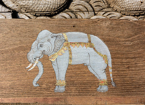 istock Paint of elephants on wood 464789653
