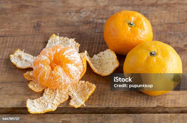 Tangerine On Wooden Table Stock Photo - Download Image Now - Citrus Fruit, Close-up, Colors