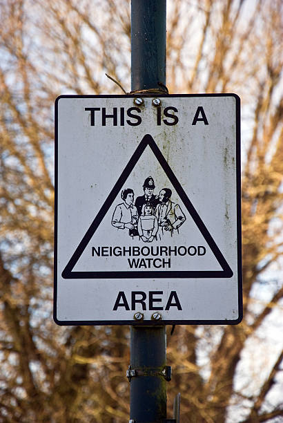 Neighbourhood watch sign A sign in the UK showing that the surrounding area is controlled by a neighbourhood watch scheme. neighborhood crime watch stock pictures, royalty-free photos & images