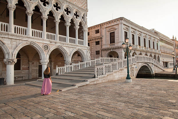 Beautiful girl in pink dress in Venice stock photo
