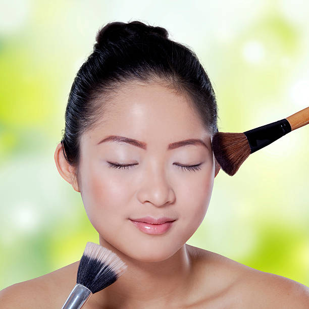 istock Asian girl apply makeup on bokeh background 464796822