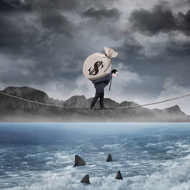 istock Manager carry a money sack above the sea 464797136