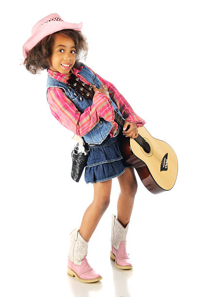 istock Cowgirl Happily Toting a Guitar 464797165