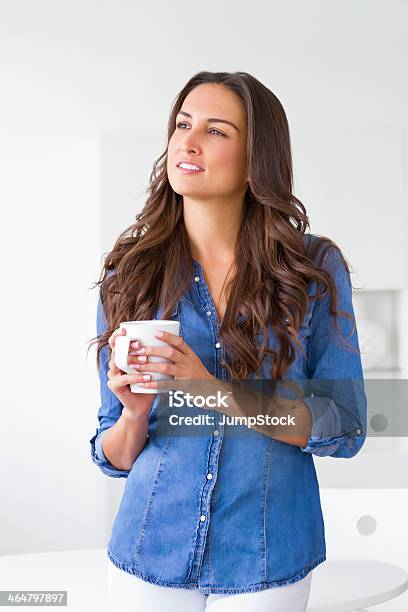 Attractive Young Woman Smiling And Drinking Coffee Stock Photo - Download Image Now - 30-39 Years, Adult, Adults Only